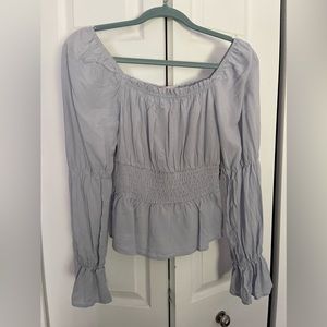 Super cute puffy sleeves. Light blue in color juniors size M